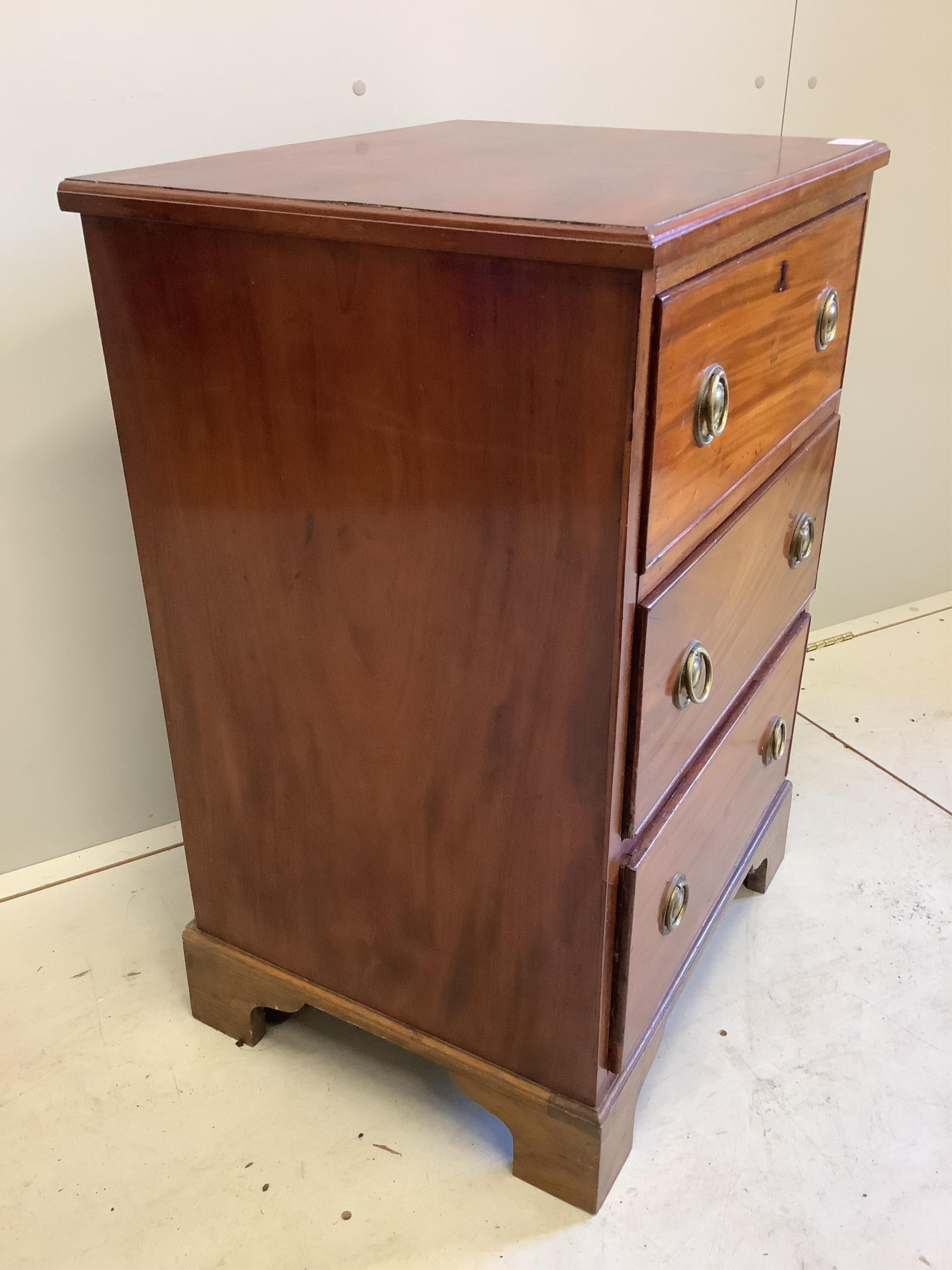 A George III style mahogany chest, fitted three long drawers, width 58cm, depth 47cm, height 85cm. Condition - fair